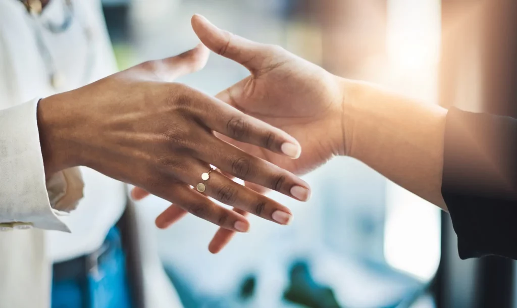 handshake between two people